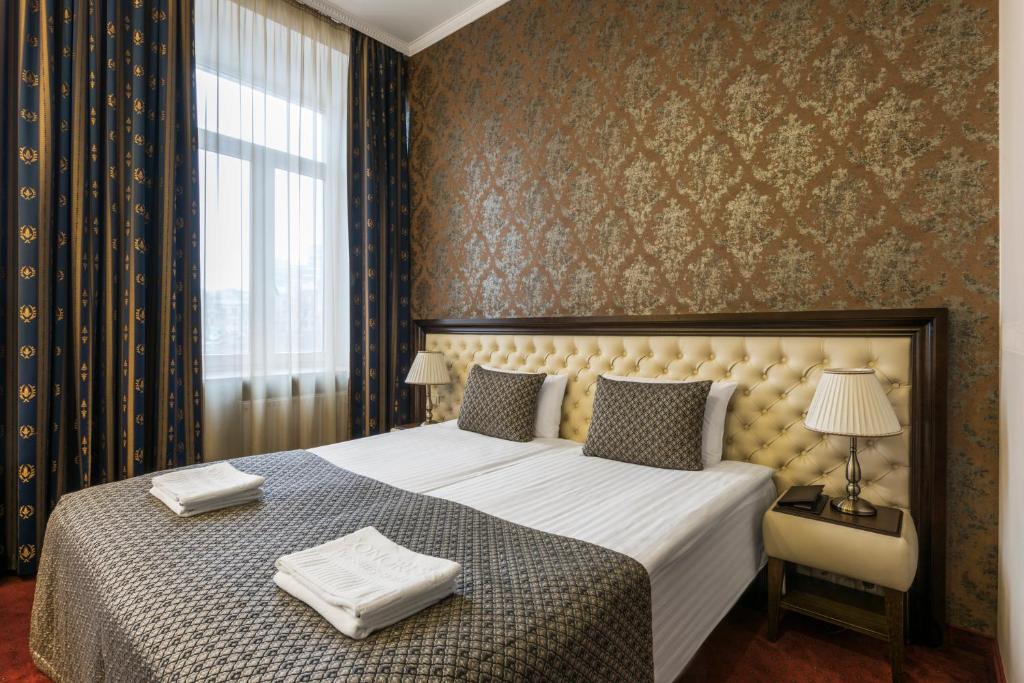 Postel nebo postele na pokoji v ubytování Congress Hotel