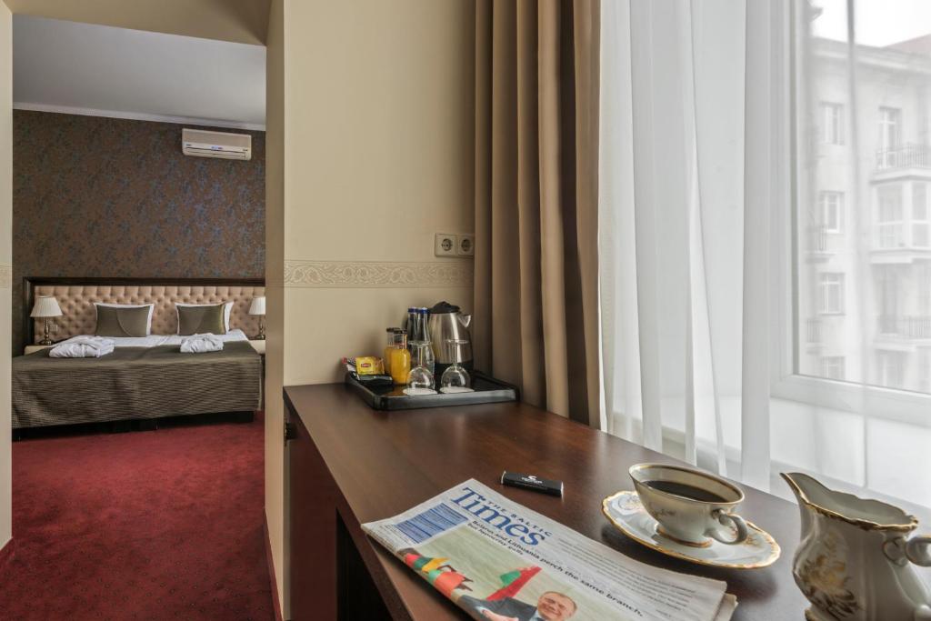 Postel nebo postele na pokoji v ubytování Congress Hotel