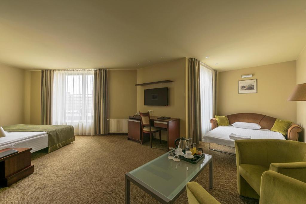 Postel nebo postele na pokoji v ubytování Congress Hotel