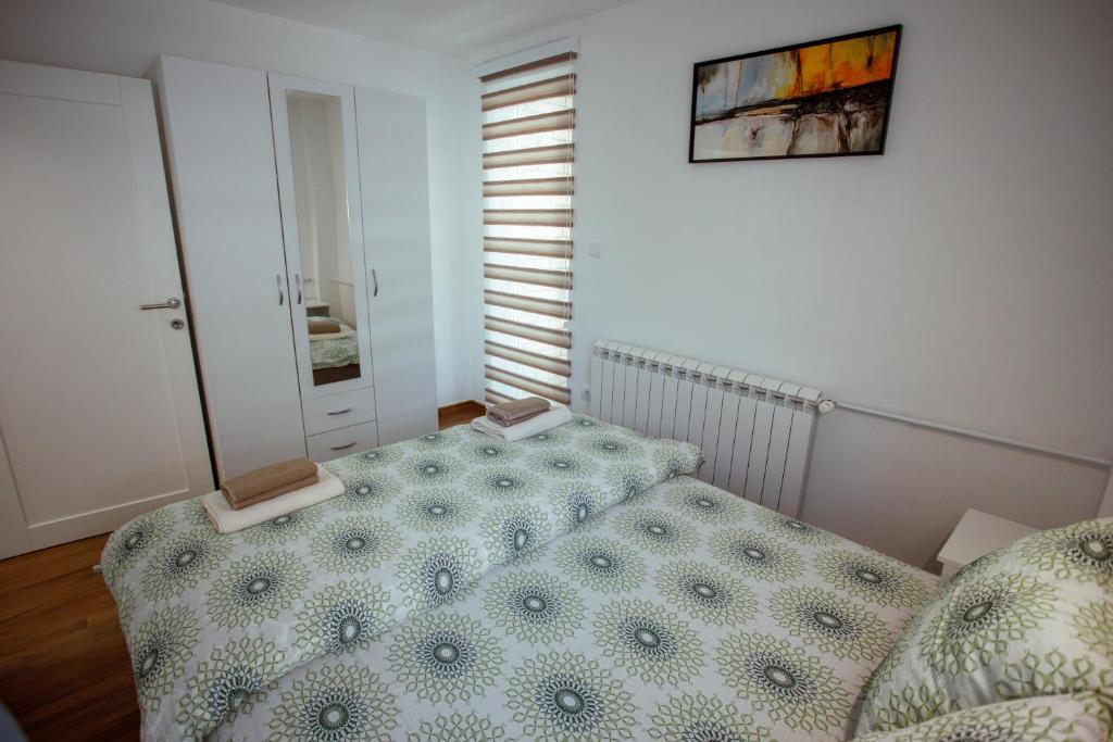 Posteľ alebo postele v izbe v ubytovaní Apartman Vesna