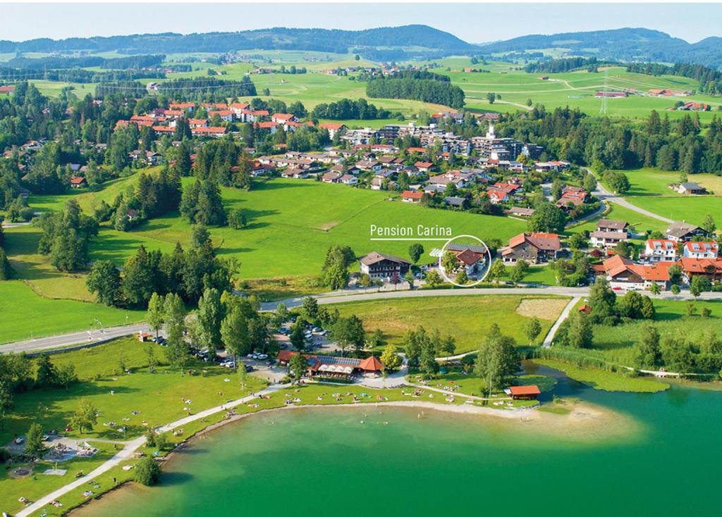 an aerial view of a town next to a lake at Pension Carina in Füssen