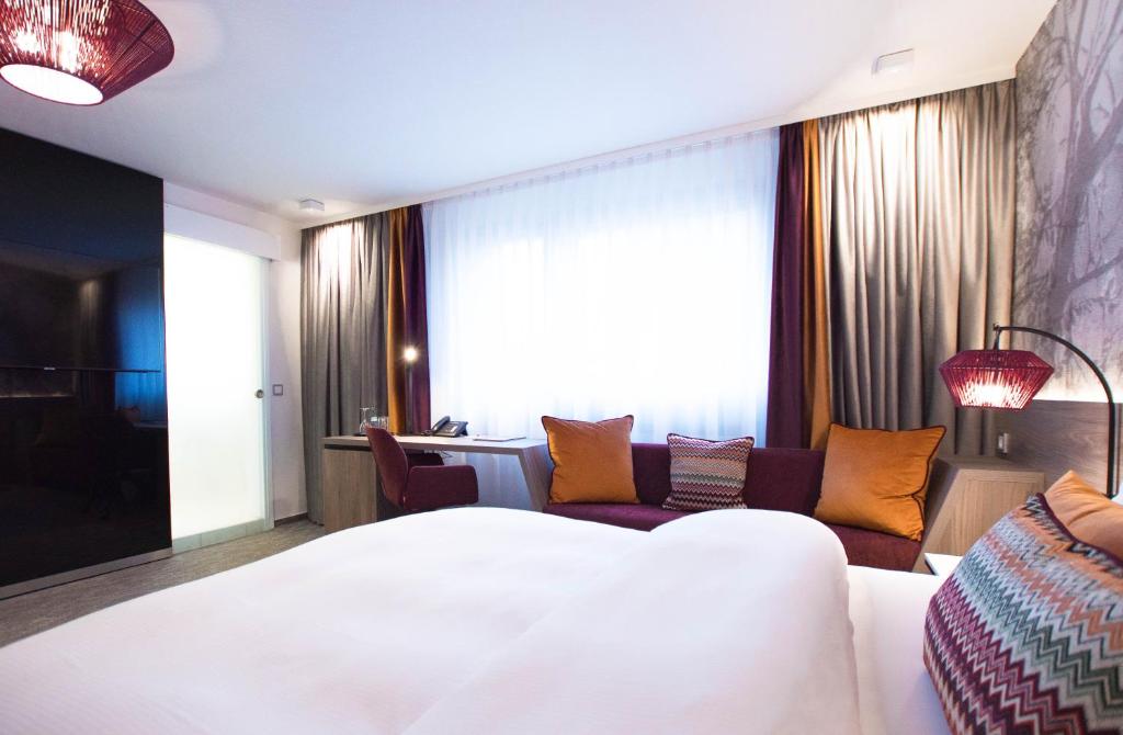 Postel nebo postele na pokoji v ubytování Hotel Boehler