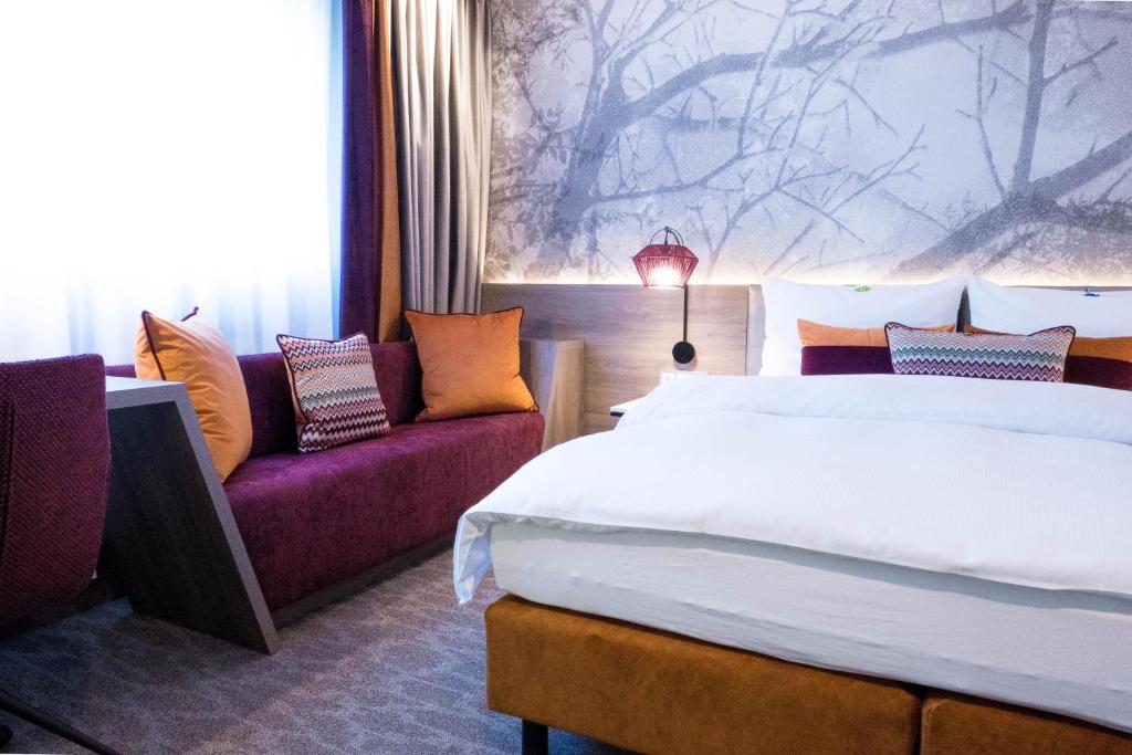 Postel nebo postele na pokoji v ubytování Hotel Boehler