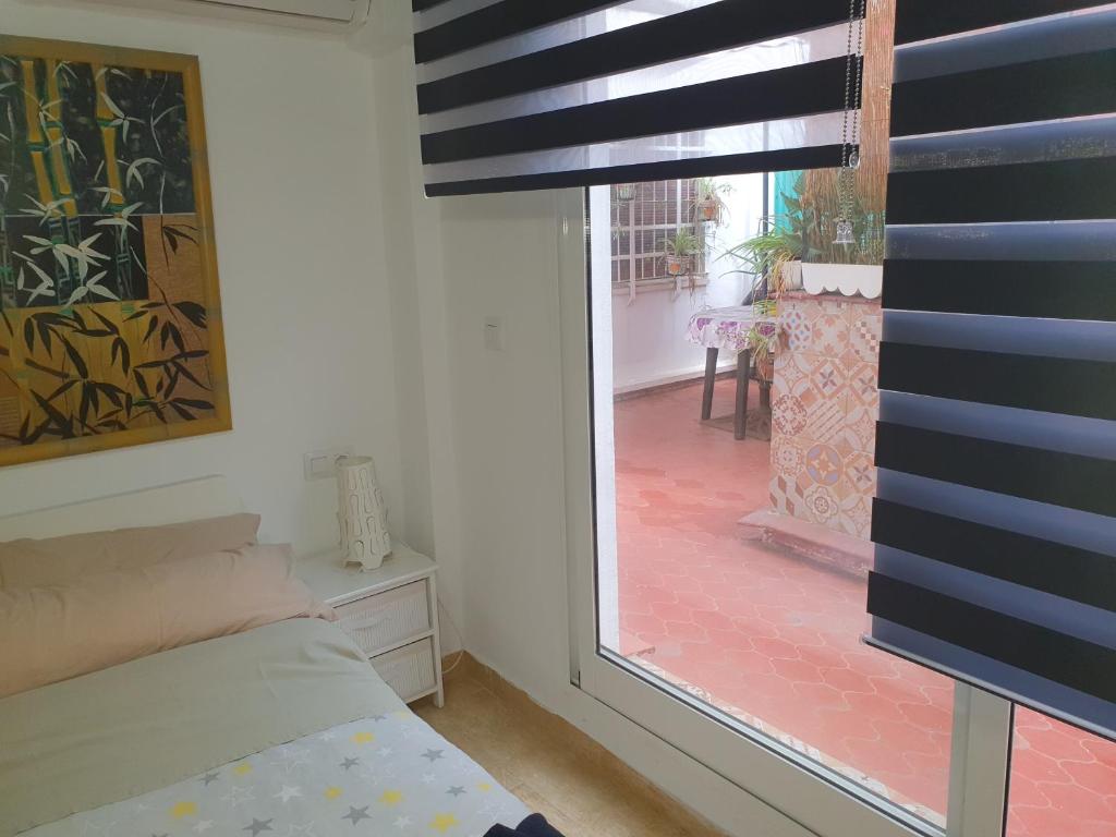 Posteľ alebo postele v izbe v ubytovaní Apartamentos Naranja y Limòn