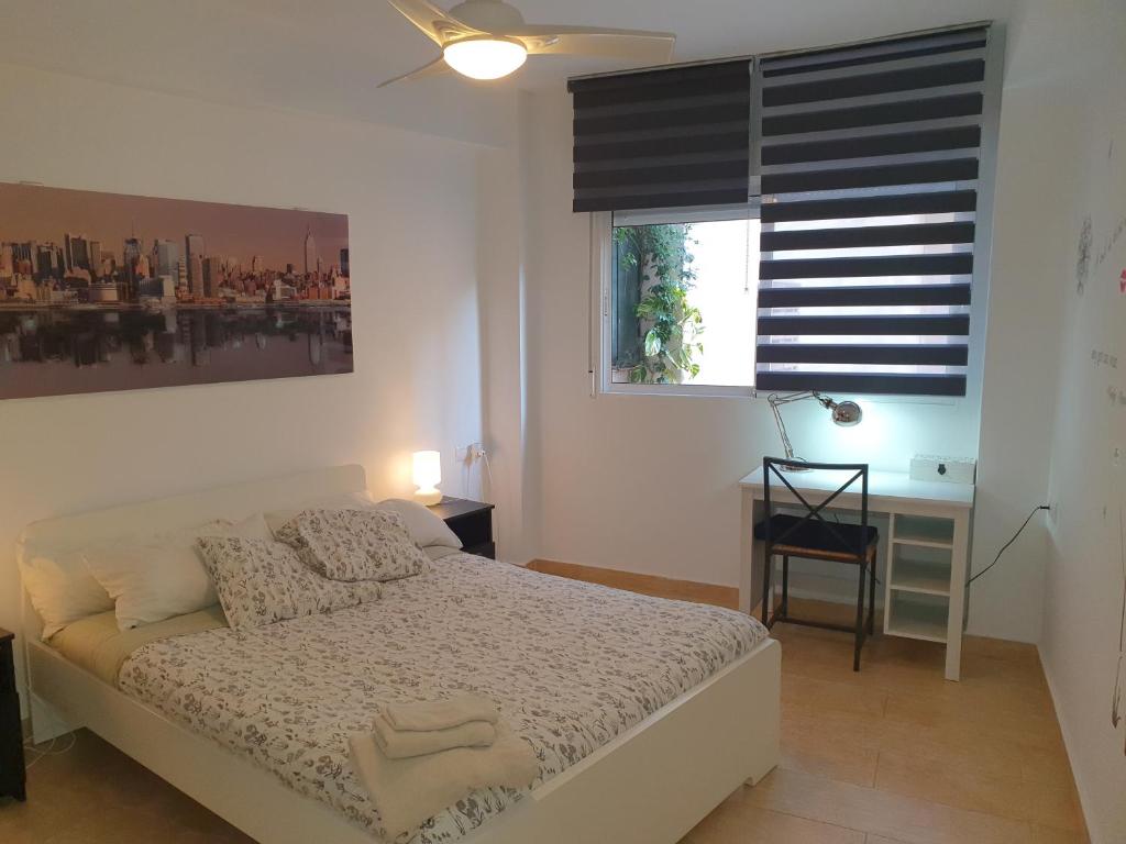 Posteľ alebo postele v izbe v ubytovaní Apartamentos Naranja y Limòn