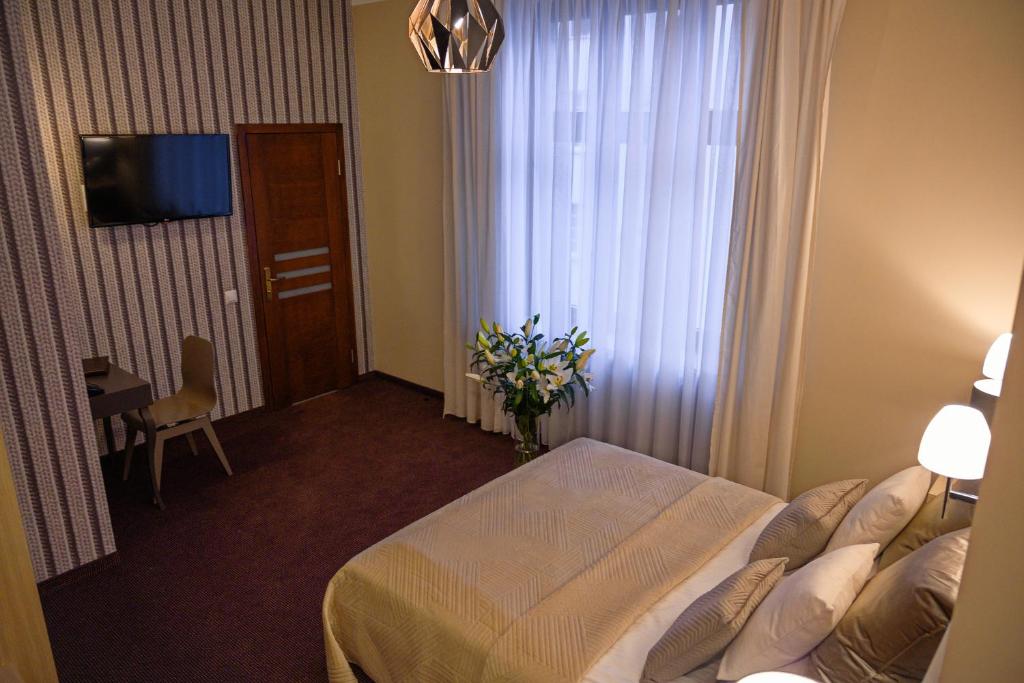 Posteľ alebo postele v izbe v ubytovaní Hotel Kazimierz II