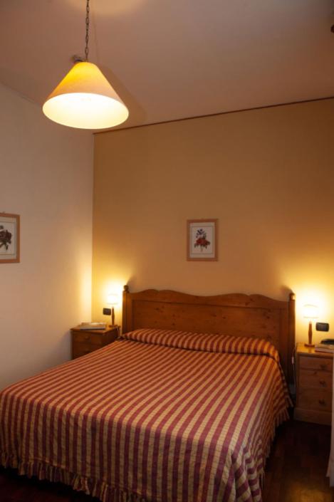 Postel nebo postele na pokoji v ubytování Hotel Melecchi