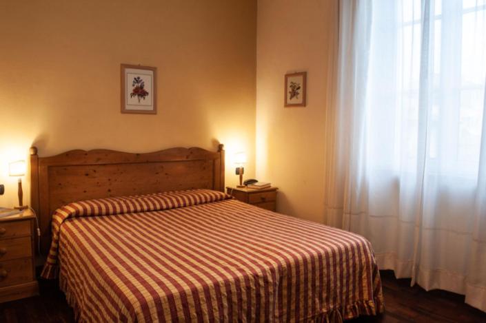 Postel nebo postele na pokoji v ubytování Hotel Melecchi