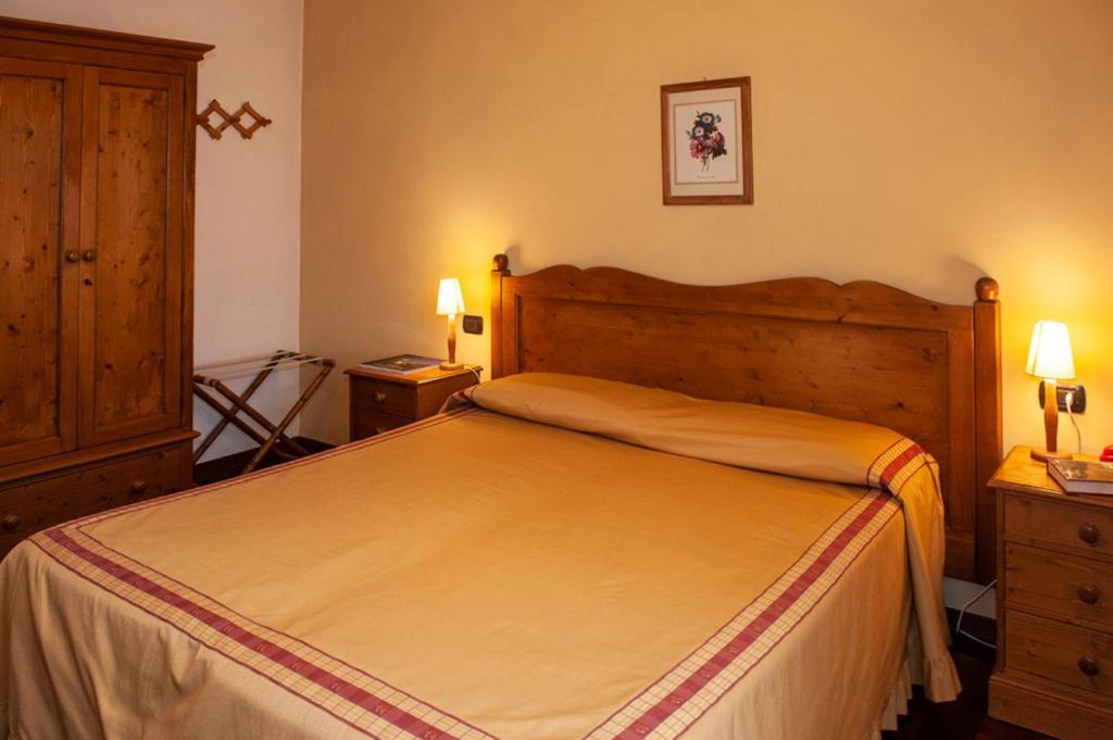 Postel nebo postele na pokoji v ubytování Hotel Melecchi