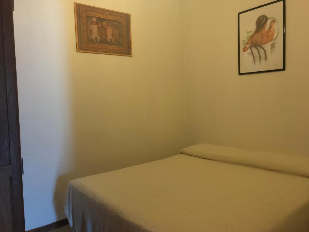 Postel nebo postele na pokoji v ubytování Giò Appartamenti Vacanze