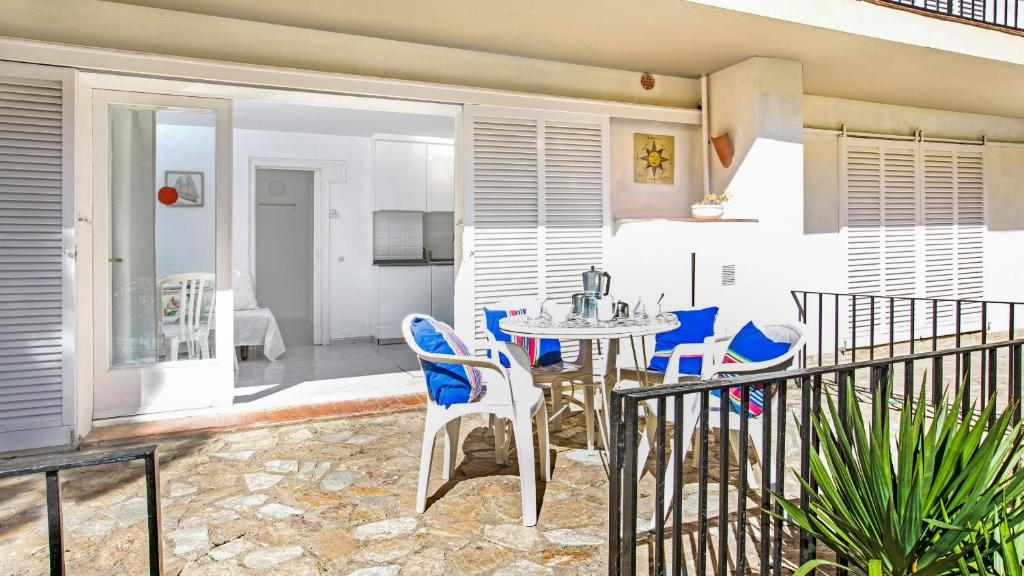 a patio with a table and chairs on a balcony at Anc 13 BP - Llafranc in Calella de Palafrugell