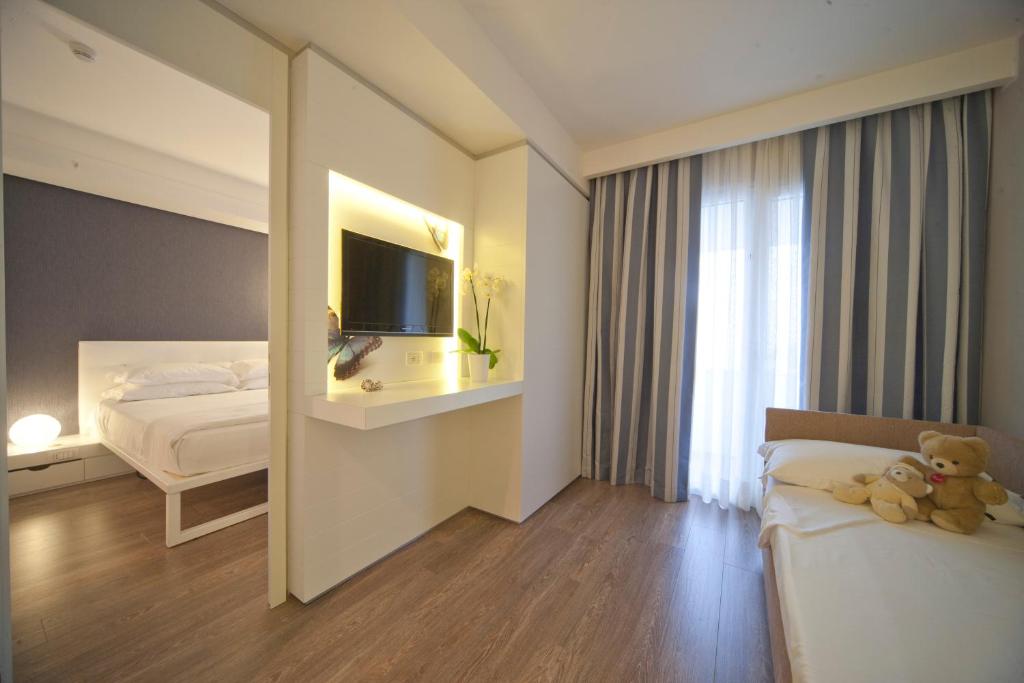 Postel nebo postele na pokoji v ubytování Oxygen Lifestyle Hotel