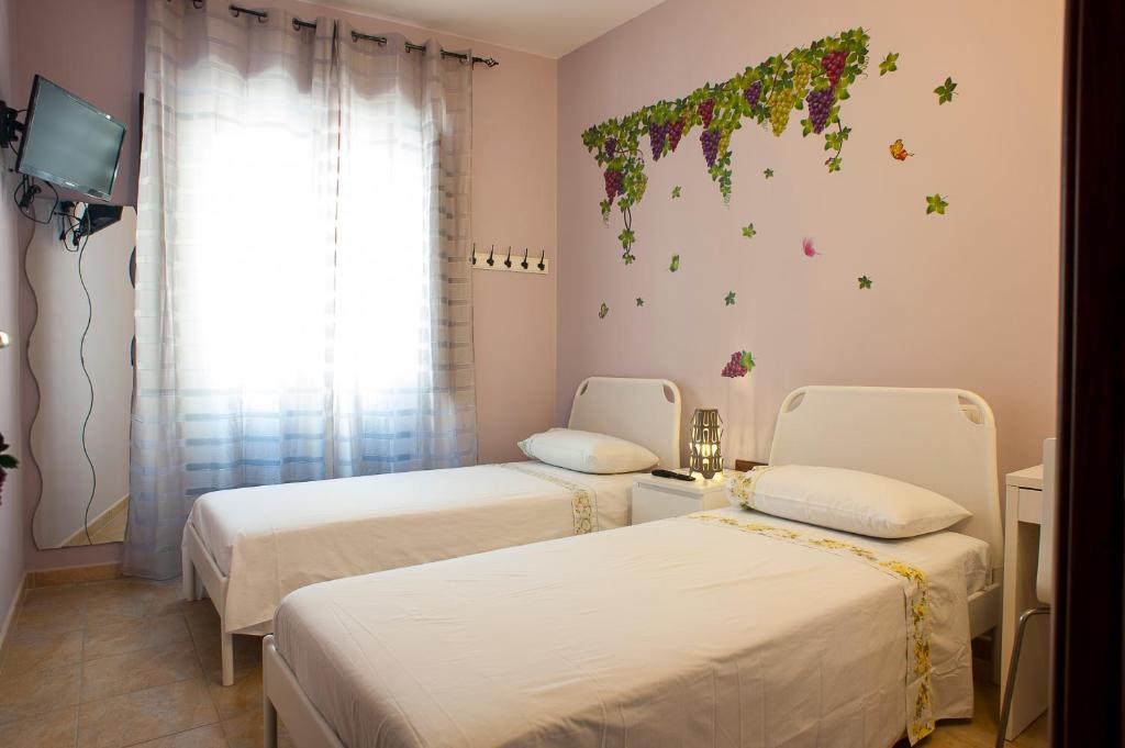 Posteľ alebo postele v izbe v ubytovaní B&B La Terrazza