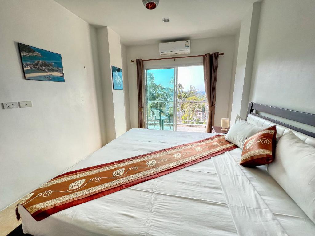 Postel nebo postele na pokoji v ubytování SR Sea View Apartments