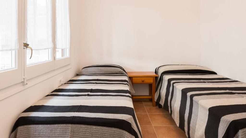 Posteľ alebo postele v izbe v ubytovaní 1Blan - Llafranc