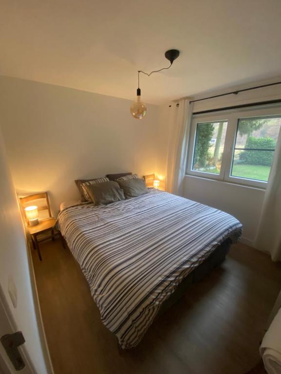 Postel nebo postele na pokoji v ubytování Maison L’ Ambléve