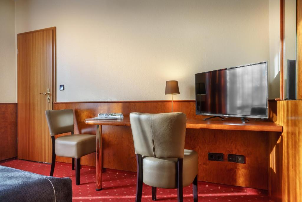 TV a/nebo společenská místnost v ubytování Hotel Hagemann Hamburg Hafen