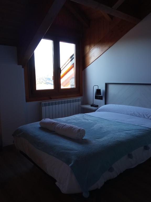 Postel nebo postele na pokoji v ubytování Apartamentos nuevos con encanto Fio de Neu