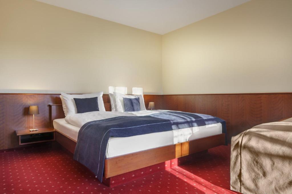 Postel nebo postele na pokoji v ubytování Hotel Hagemann Hamburg Hafen