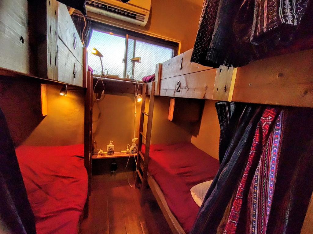 Postel nebo postele na pokoji v ubytování Guest House mii