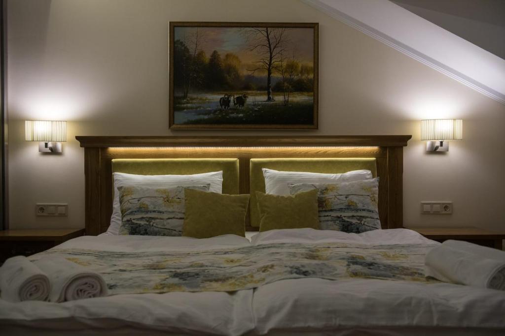 Posteľ alebo postele v izbe v ubytovaní Robinia Rooms