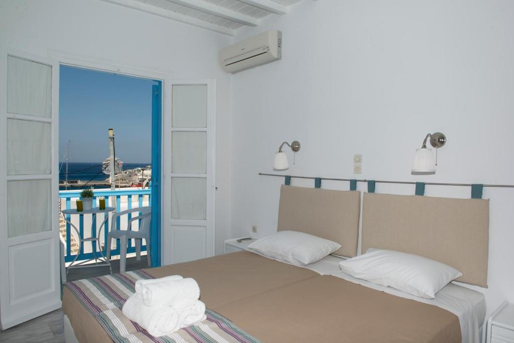 Postel nebo postele na pokoji v ubytování Asimina