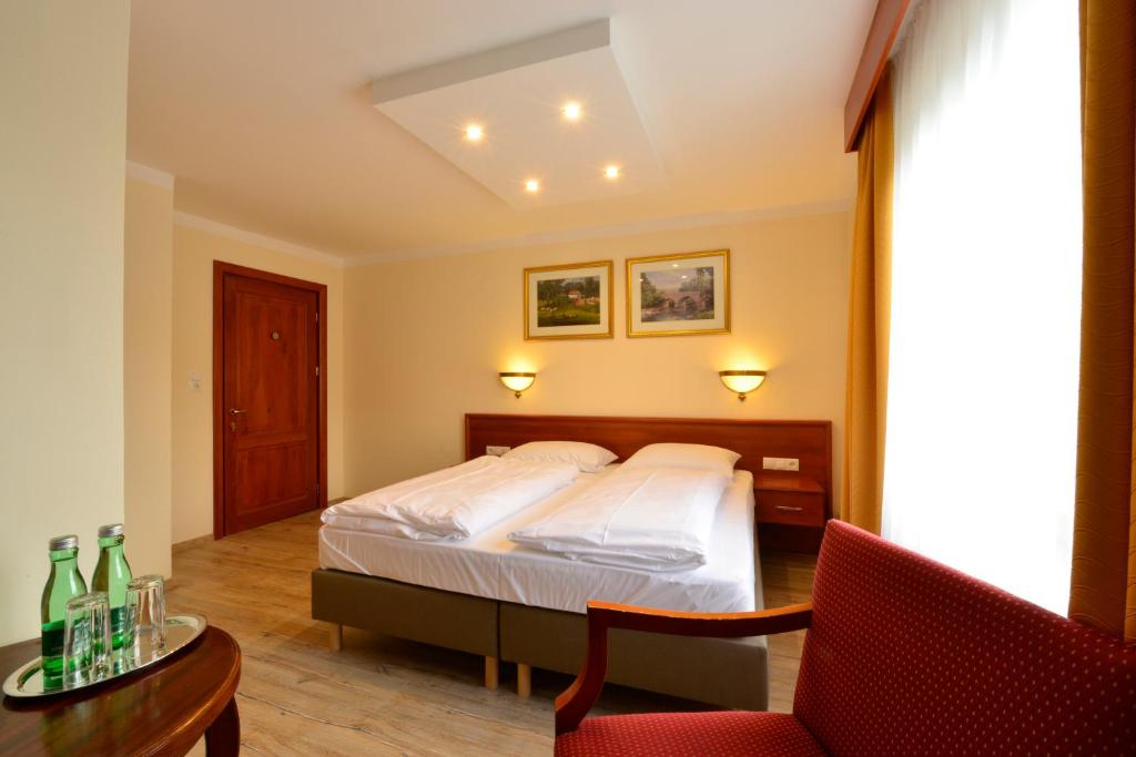 Een bed of bedden in een kamer bij Hotel Beretta