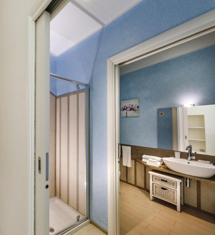 a bathroom with a shower and a sink at Hotel La Villa Del Mare in Cagliari