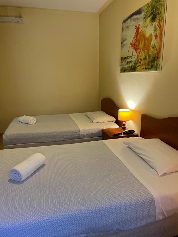 Postel nebo postele na pokoji v ubytování Hotel Antica Dogana