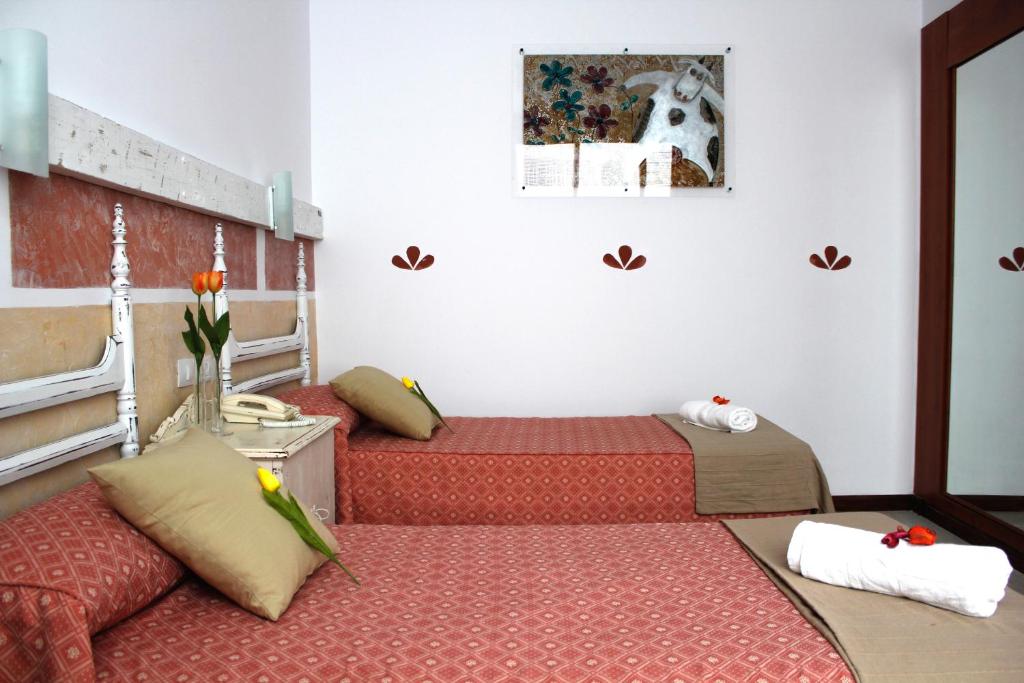 Posteľ alebo postele v izbe v ubytovaní 4Dreams Hotel Chimisay