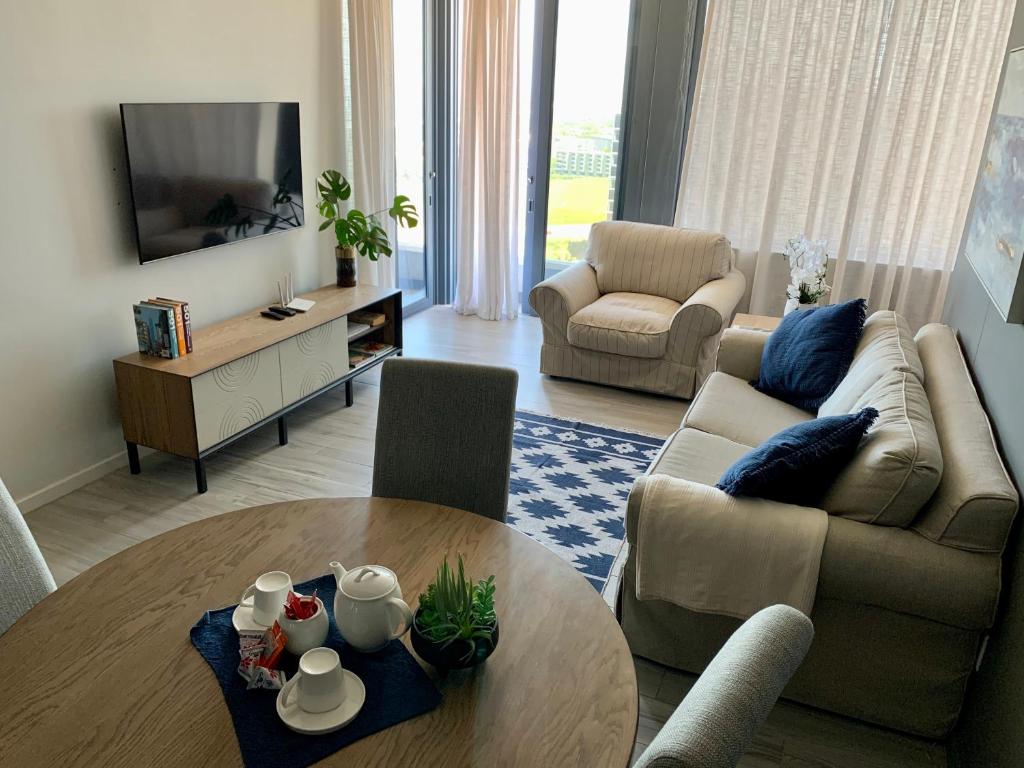 a living room with a couch and a table at Umhlanga Arch 703 Sea View self-catering in Durban