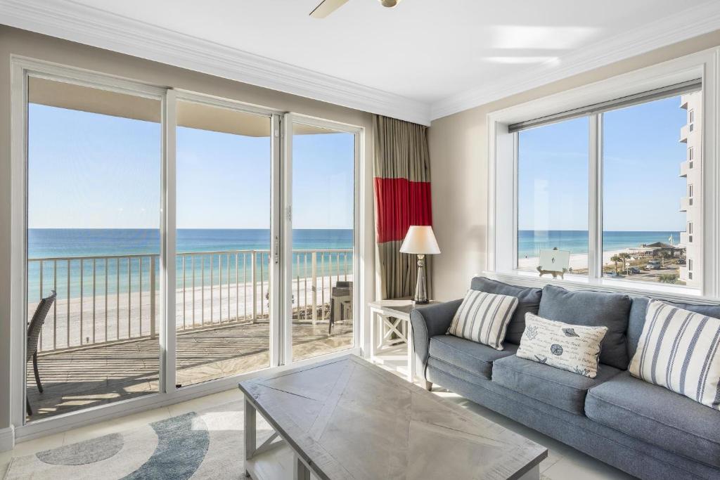 a living room with a couch and a view of the ocean at Majestic Sun 414B in Destin