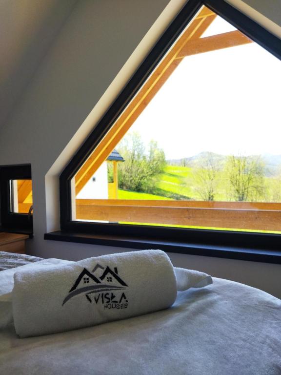 Postel nebo postele na pokoji v ubytování Chatki wisla houses