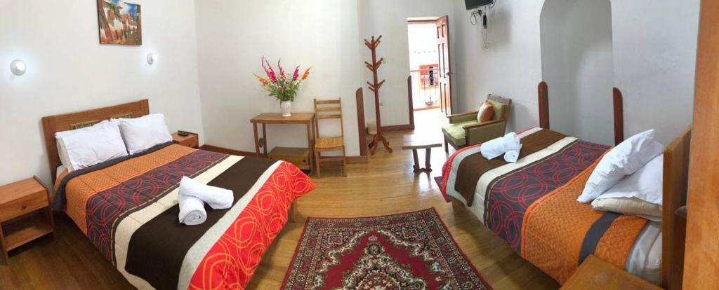 Postel nebo postele na pokoji v ubytování Casa Union Cusco