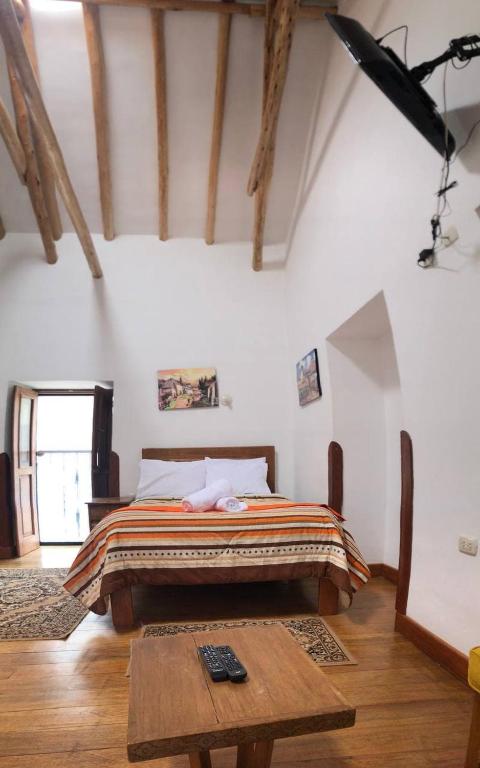 Postel nebo postele na pokoji v ubytování Casa Union Cusco
