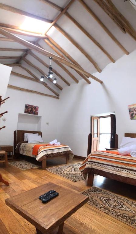 Postel nebo postele na pokoji v ubytování Casa Union Cusco