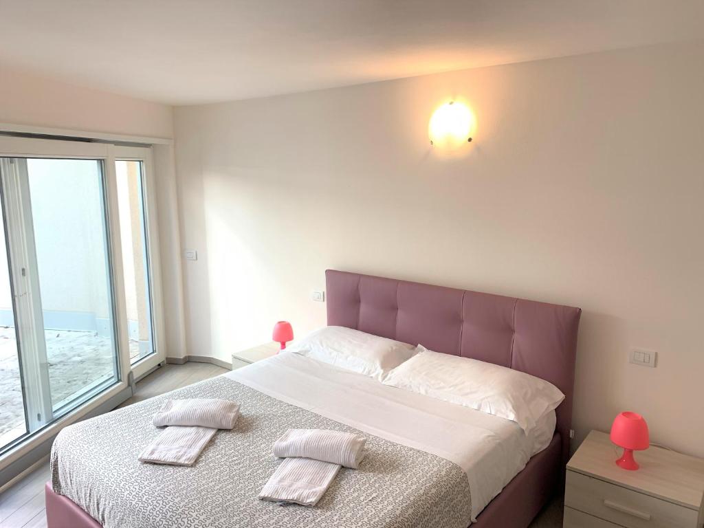 Postel nebo postele na pokoji v ubytování Camere e case vacanza Residenza Prealba