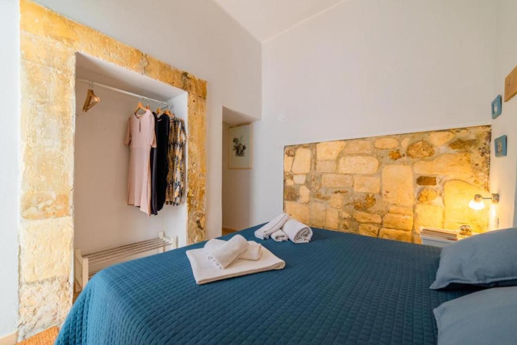 Posteľ alebo postele v izbe v ubytovaní Civico Dieci Holiday Home