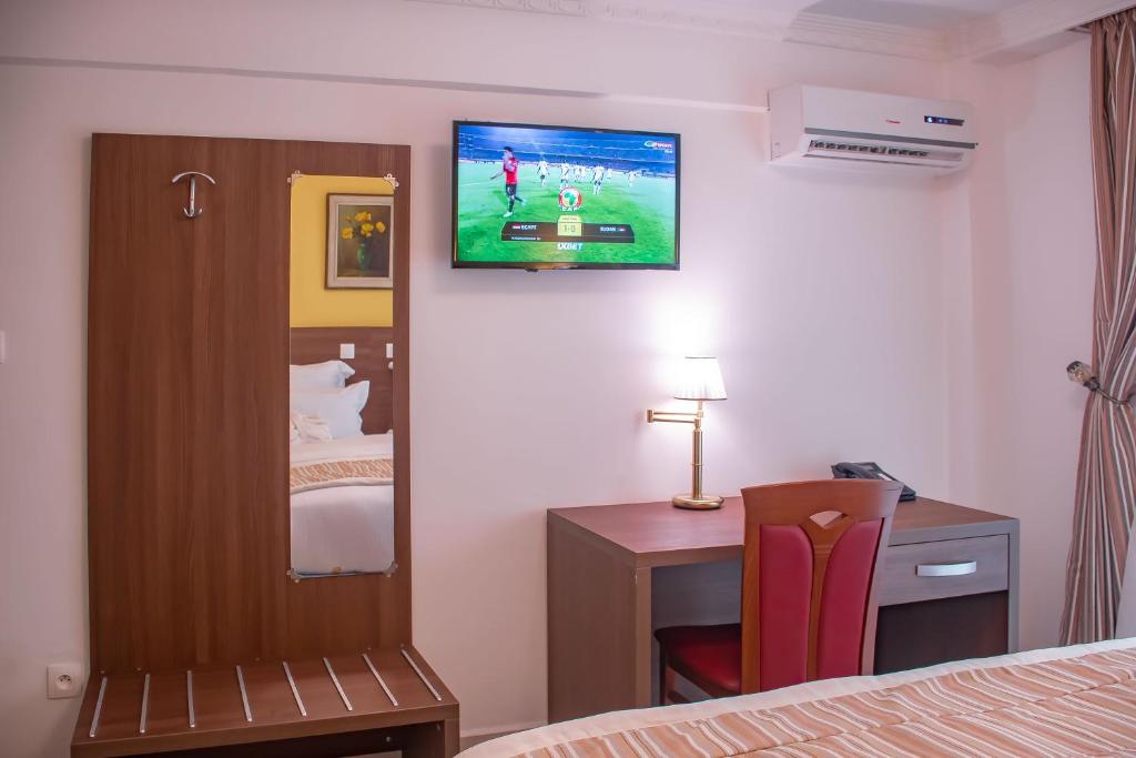 Postel nebo postele na pokoji v ubytování FAYA Hotel