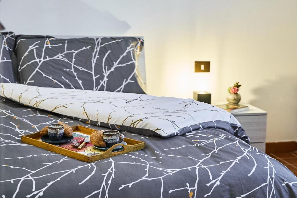 Łóżko lub łóżka w pokoju w obiekcie ✦ GARDEN HOUSE IN CENTRO - FREE PARKING ✦