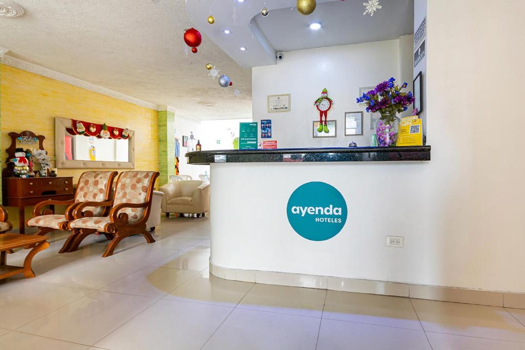 a waiting room at a hospital with two chairs at Hotel Cavalier Suites Cùcuta in Cúcuta