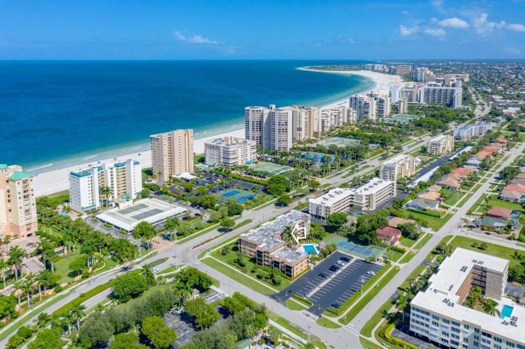 an aerial view of a city and the beach at Prime Location I 2 Bed Setup Directly Across Street From South Beach Access in Henry Key