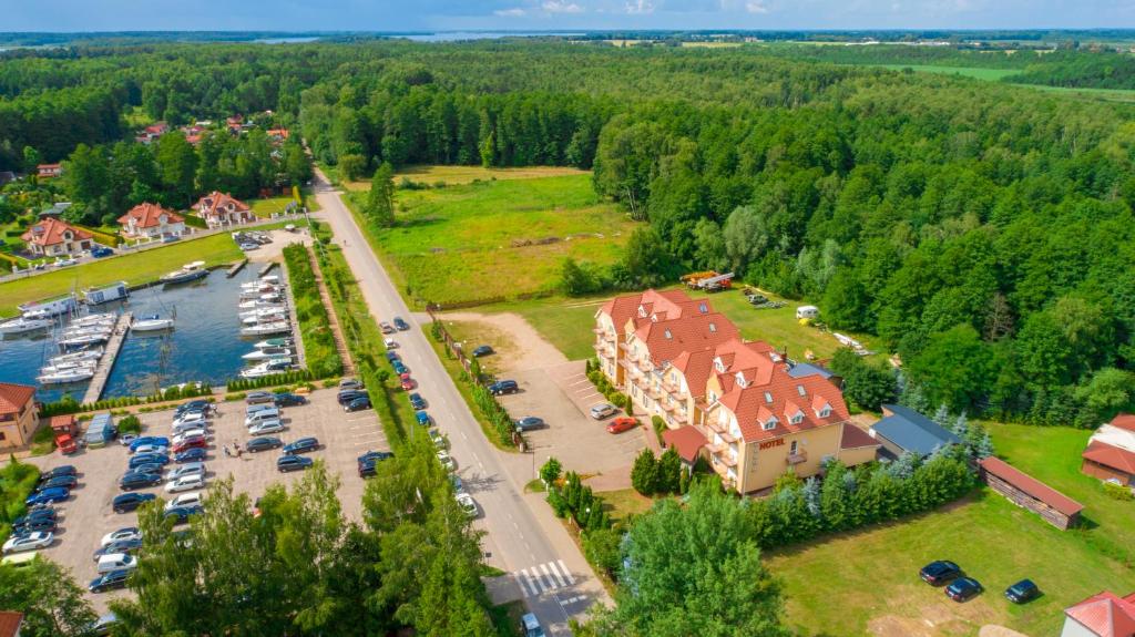 an aerial view of a marina with cars parked at Hotel Helena in Giżycko