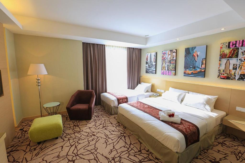 Postel nebo postele na pokoji v ubytování Eco Tree Hotel, Melaka