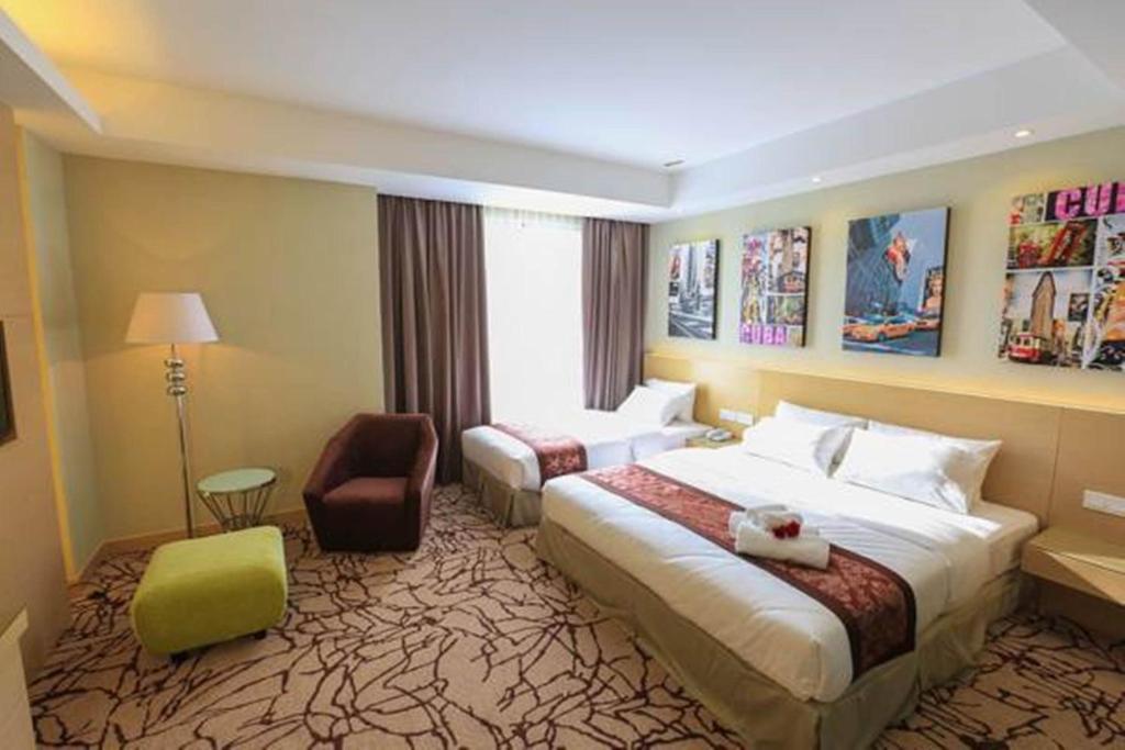 Postel nebo postele na pokoji v ubytování Eco Tree Hotel, Melaka