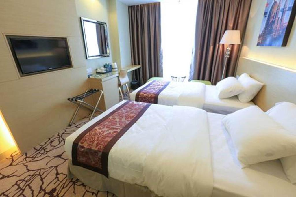 Postel nebo postele na pokoji v ubytování Eco Tree Hotel, Melaka