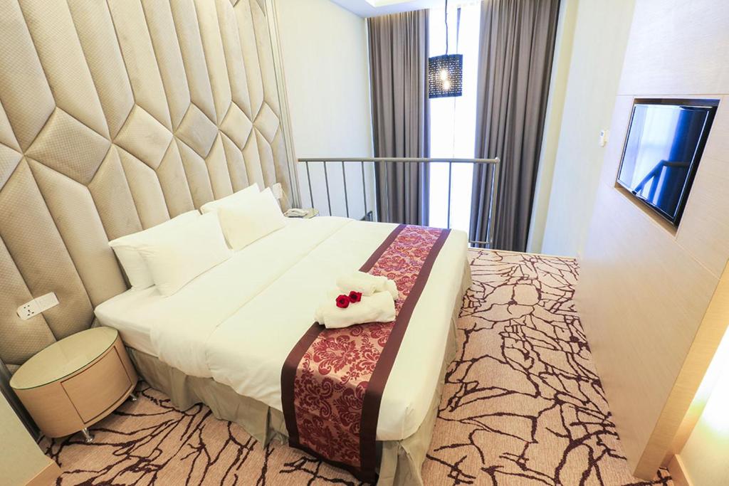Postel nebo postele na pokoji v ubytování Eco Tree Hotel, Melaka