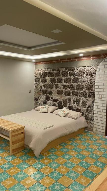 Postel nebo postele na pokoji v ubytování PEQUEÑO ENCANTO Hotel Boutique