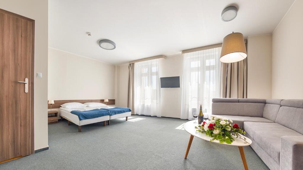 Postel nebo postele na pokoji v ubytování Hotel Zorza