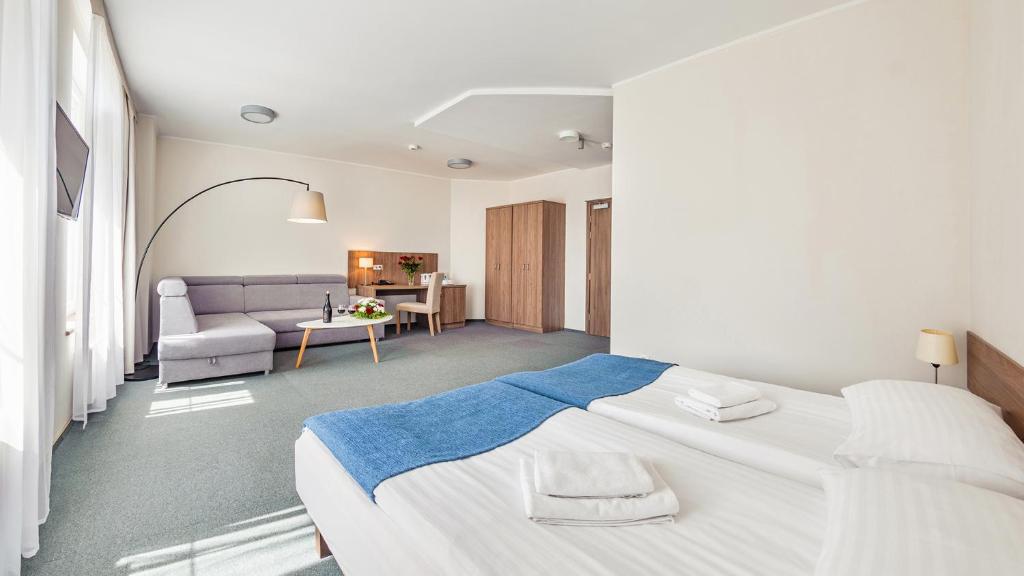 Postel nebo postele na pokoji v ubytování Hotel Zorza